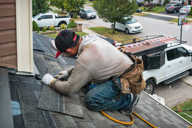 Professional Flat Roof Repair technician working in Camden, IL